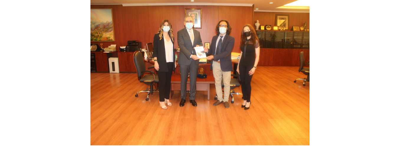 President Fouad Ayoub receives a new publication from the delegation of the Faculty of Pedagogy